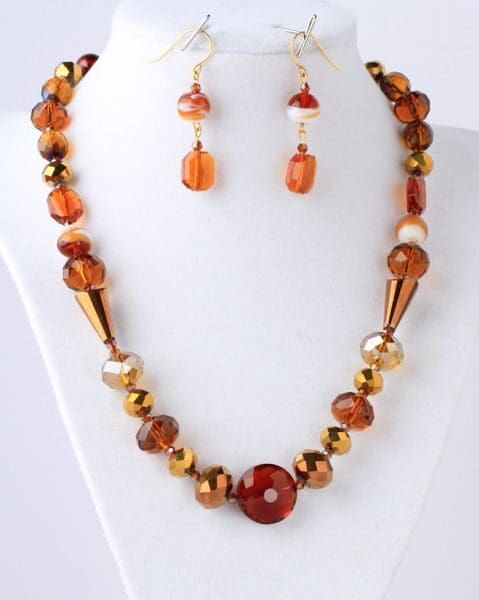 A necklace and earrings set of brown beads.