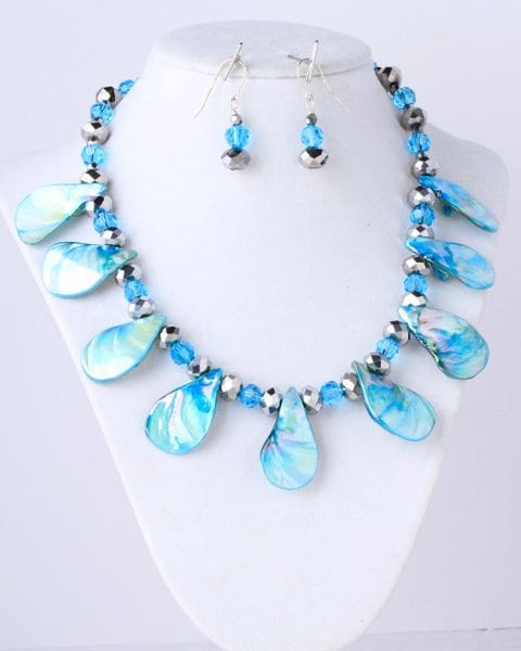 A necklace and earrings set with blue beads