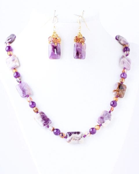 A necklace and earrings set made of amethyst.