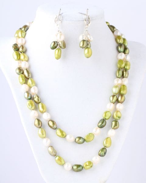 A necklace and earrings set of green and white beads.