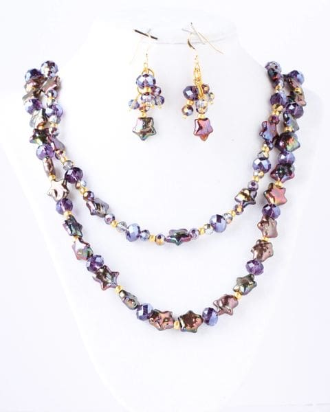 A necklace and earrings set with purple beads.